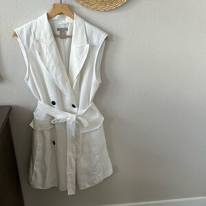 Above knee length white linen blend vest dress with buttons down the front